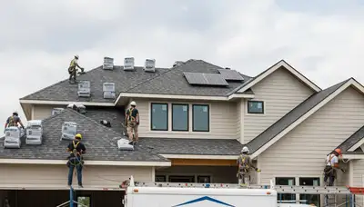 Roof and vinyl siding installation in Virginia Beach VA by Next Level Exteriors crew